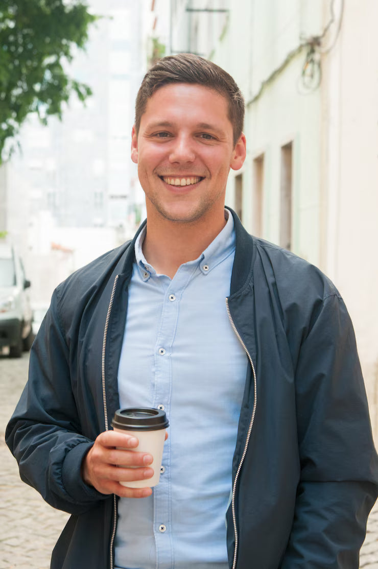 files/cheerful-guy-enjoying-outdoor-coffee-break_1262-20005_1.avif